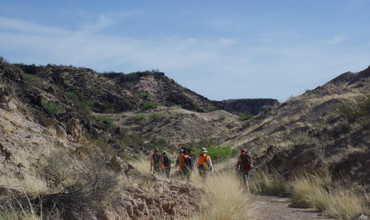 The GEODES team embarks on the two-mile hike out of Kilbourne Hole.