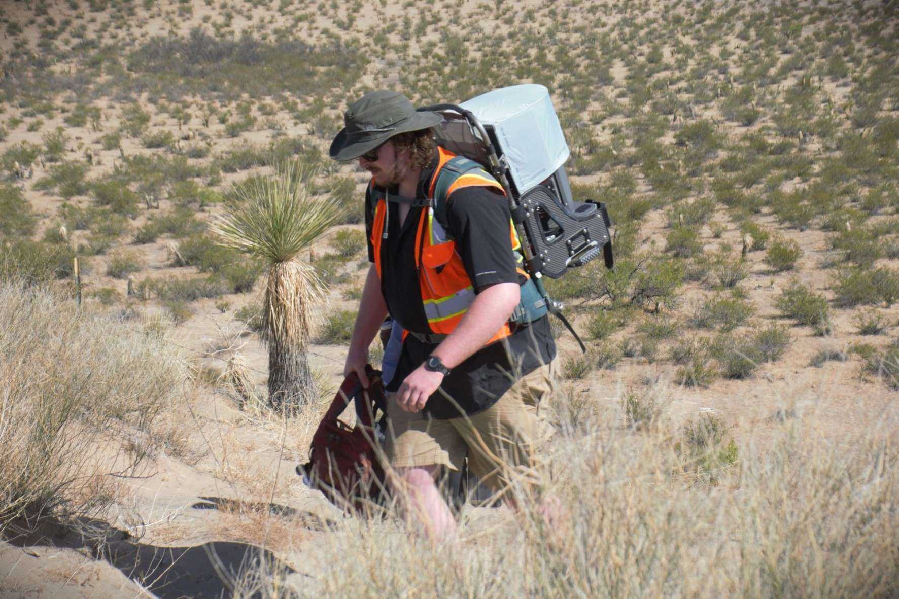 SBU graduate student Reed Hopkins traverses Potrillo Volcanic Field in New Mexico, April 2022