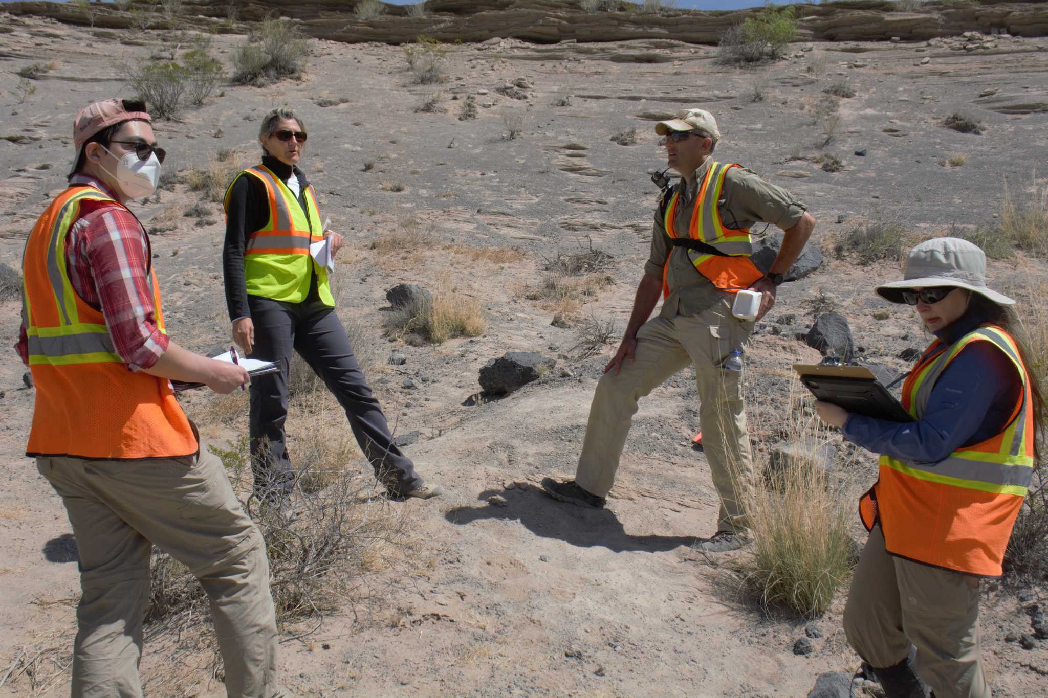 Zach Morse leads discussion on EVAs with NASA colleagues at Potrillo Volcanic Field in New Mexico, April 2022