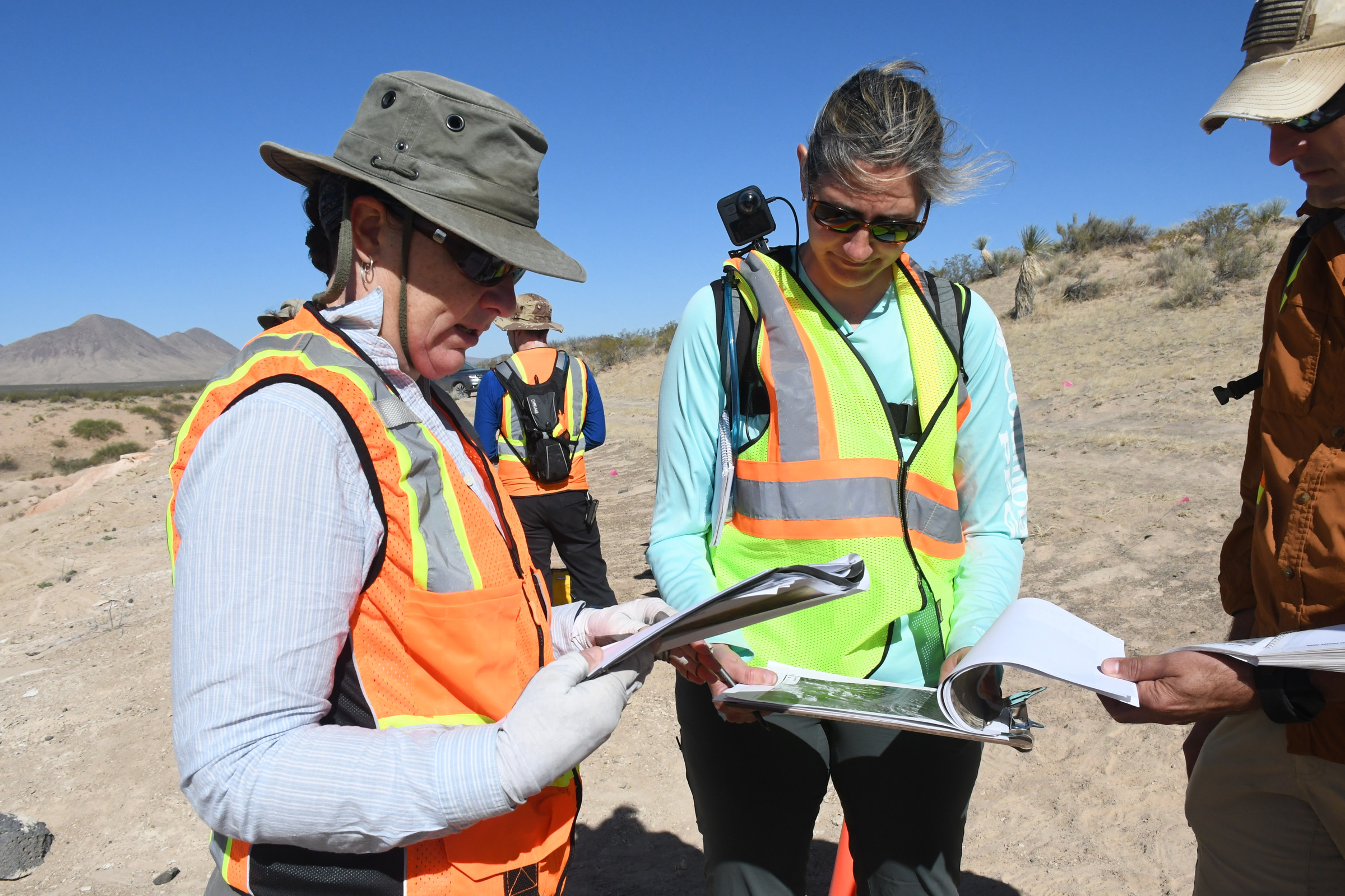Alice Baldridge examines data with colleagues at Potrillo Volcanic Field in New Mexico, April 2022